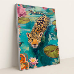This artwork shows a colorful illustration of a jaguar swimming in a pond with water lilies and vibrant floral patterns, in a silver frame.