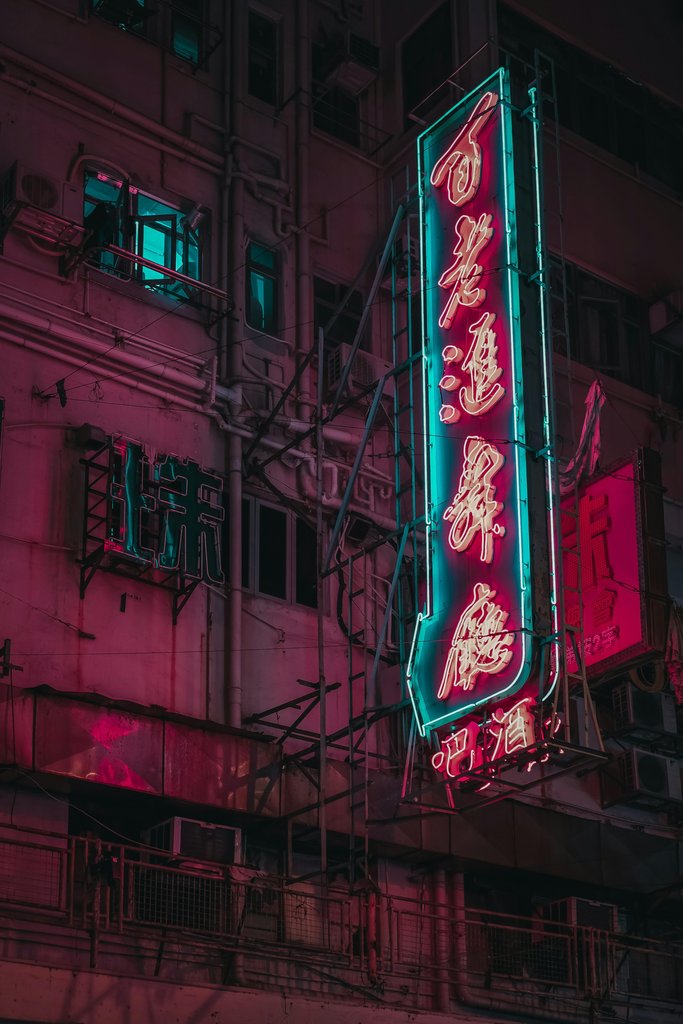 Turned-on kanji script neon signage at the building by Airam Dato-on