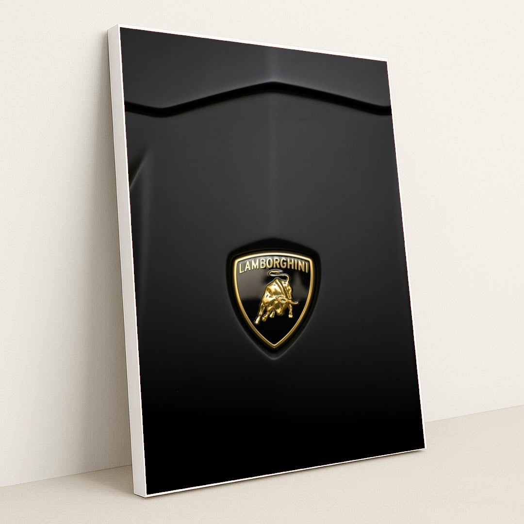 This photo shows a close-up of a Lamborghini badge on a matte black car hood, in a white frame.