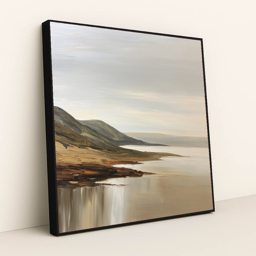This artwork features a tranquil coastal landscape with rolling hills and calm waters painted in soft neutral tones, displayed in a black frame.