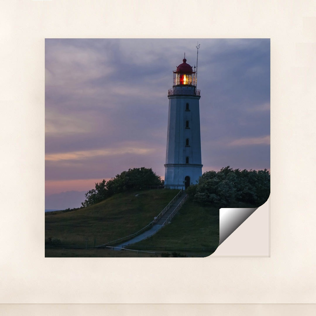 Illuminated Coastal Lighthouse on Hill During Evening Twilight by Karl Knips - Peeliez