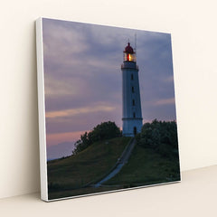 Illuminated Coastal Lighthouse on Hill During Evening Twilight by Karl Knips - White Frame Stretchiez