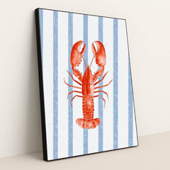 Coastal Crustacean Chic artwork features a vibrant red lobster on a blue and white striped background, displayed in a black frame.