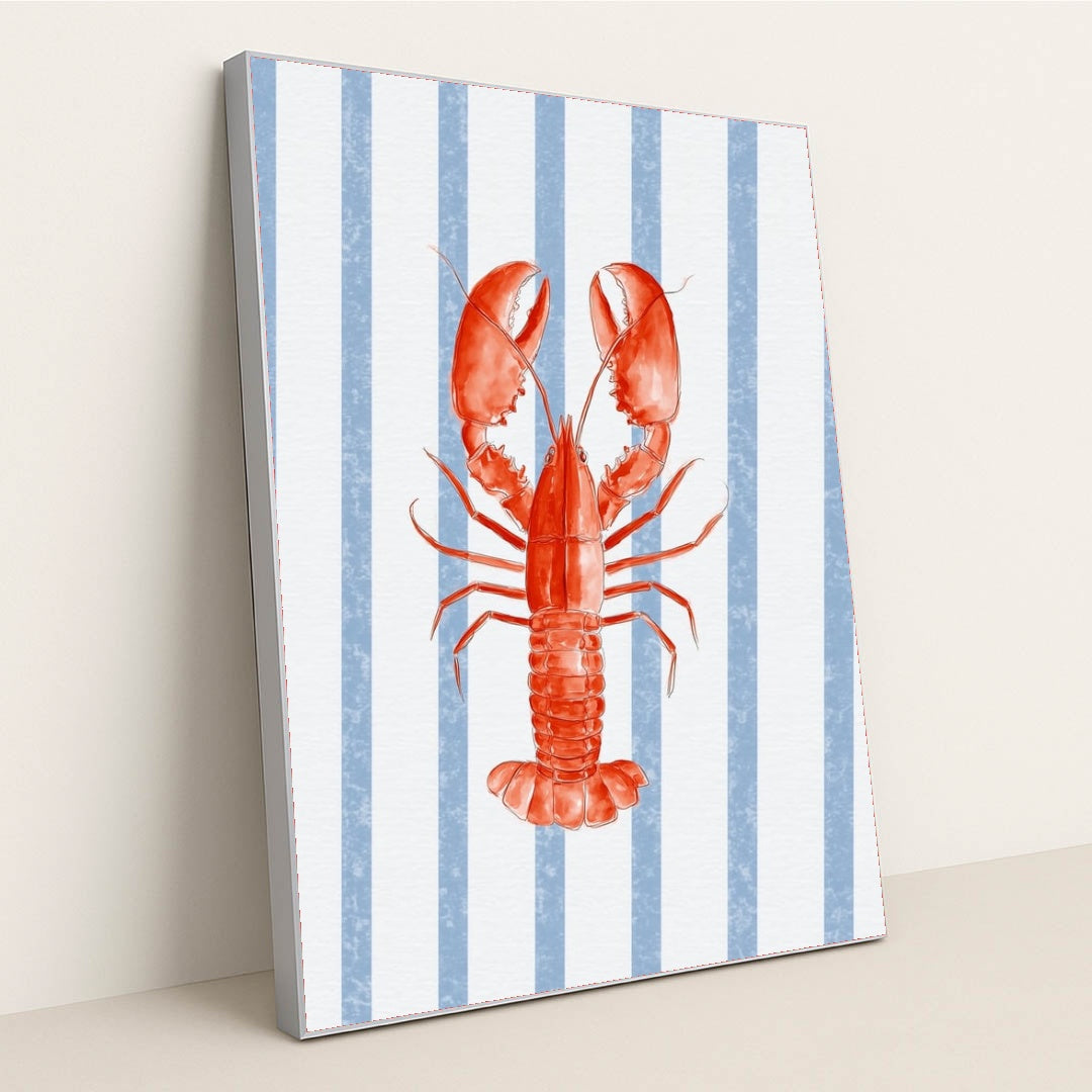 Coastal Crustacean Chic artwork features a vibrant red lobster on a blue and white striped background, displayed in a silver frame.