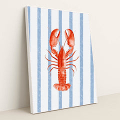 Coastal Crustacean Chic artwork features a vibrant red lobster on a blue and white striped background, displayed in a white frame.