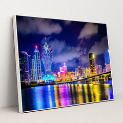 Vibrant Macau Cityscape Illuminated at Night by Anonymous - White Frame Stretchiez