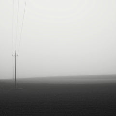 Simon Berger - A minimalist foggy landscape with power lines in Pinsdorf, Oberösterreich.