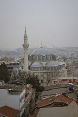 Kübra  Kuzu - Overhead view of Rustem Pasha Mosque amidst Istanbul's urban skyline, showcasing historic architecture.