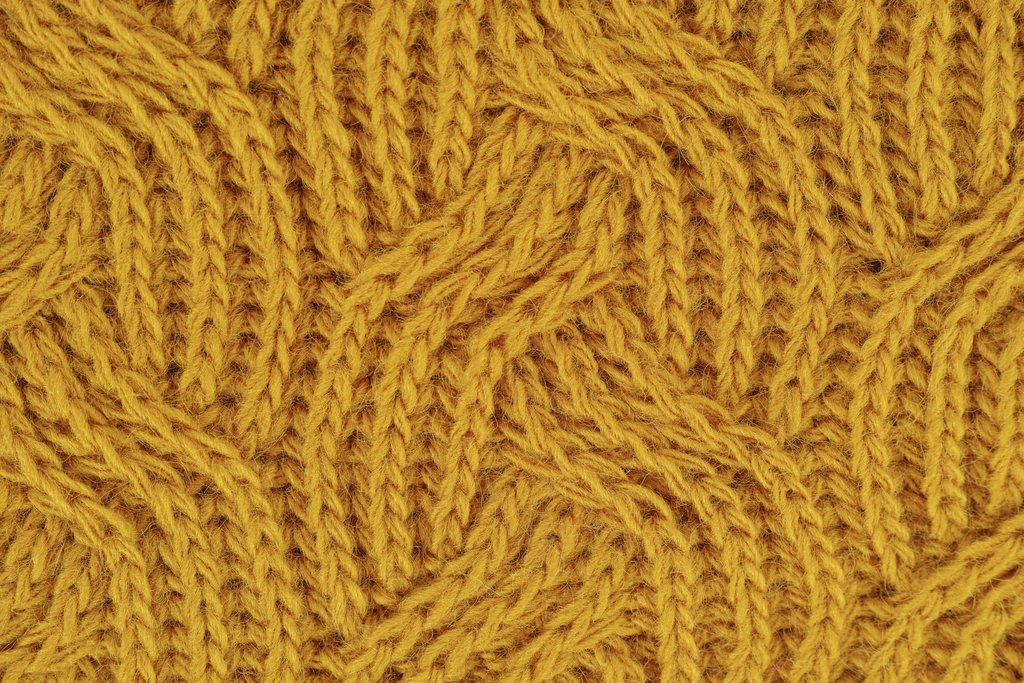Engin Akyurt - Detailed close-up of a yellow knitted wool pattern, ideal for textile design.