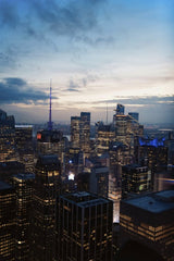Shojol Islam - Stunning aerial view of New York City skyscrapers illuminated at dusk.