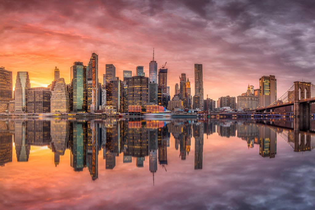 Sunset Serenity: Iconic New York City Skyline at Dusk by Anonymous