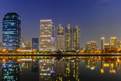 Stock Photos - Panorama building city in business area night scene with river reflection in Bangkok, Thailand.