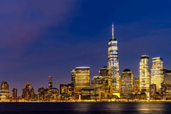 Stock Photos - New York city Lower Manhattan skyline cityscape at dusk from New Jersey.
