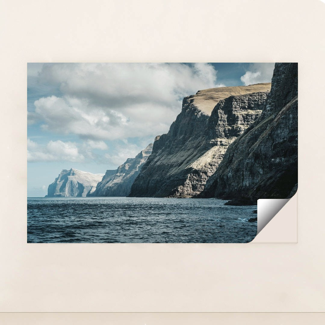 Majestic Ocean Cliffs Under Cloudy Sky by Raul Ling - Peeliez