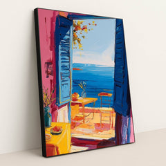 This artwork shows an impressionist-style open blue window with a seaside view, vibrant flowers, and a cozy patio scene, in a black frame.