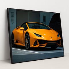 This photo shows an orange Lamborghini Huracán Spyder parked in a valet area at night, in a black frame.