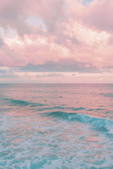 Pink Clouds at Dusk Above Ocean Waves with Surfers by Jess Loiterton