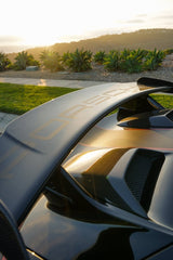 Porsche Golden Hour car wall art featuring a rear wing and sunset light, highlighting engineering and lifestyle.