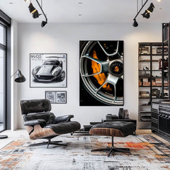 Porsche Precision Wheel close-up in stylish car-themed living room, showcasing alloy finish and bold brake caliper as art.