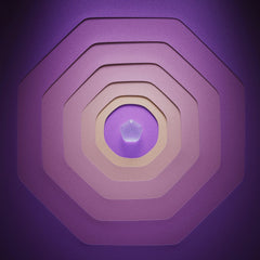 Rostislav Uzunov - A vibrant geometric pattern in purple featuring layered shapes and a central gem.