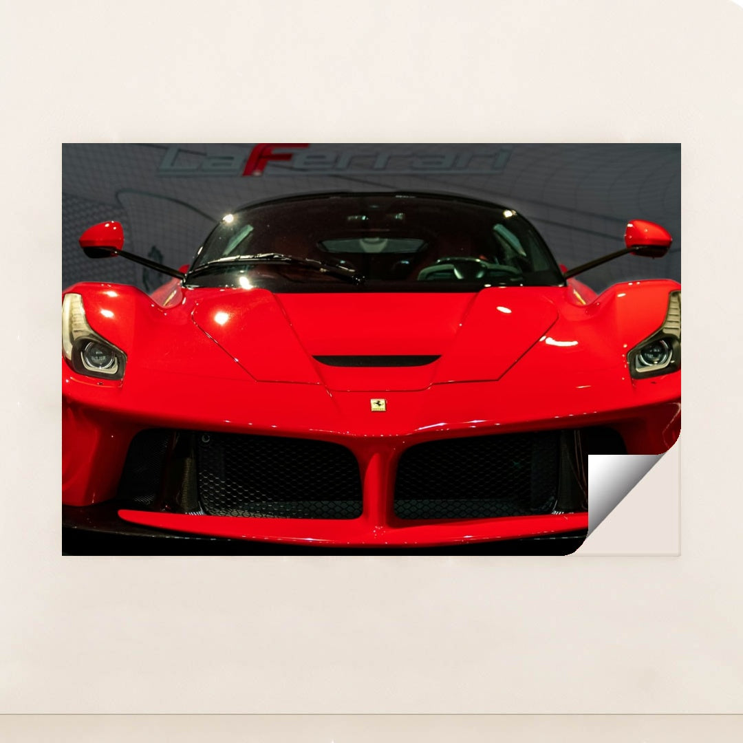 This photo shows the front view of a red Ferrari LaFerrari at an indoor car show, unframed style.