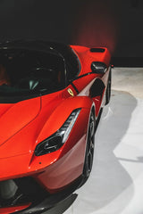 LaFerrari Detail Shot: Close-up view of a red LaFerrari highlighting its sleek design, perfect for car wall art.