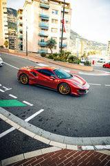 Ferrari 488 Pista Cruising Monaco on a sunlit street, showcasing luxury car wall art with gold wheels and bold stripes.