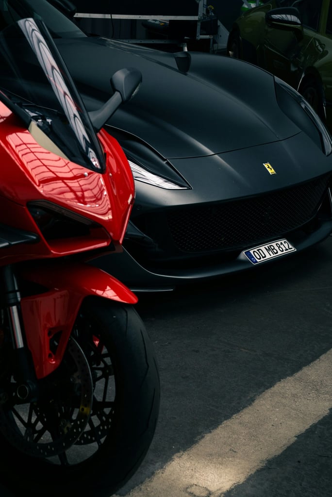 Ferrari vs. Superbike in a dimly lit industrial setting, showcasing Italian engineering in car wall art.