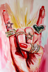 This artwork shows a hand with red nails wearing sparkly rings shaped like stars and a heart, set against pink painted brushstrokes.