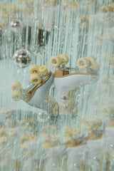 Samantha Billotte - Retro roller skates in a sparkling disco setting with hanging glitter and lights.