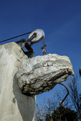 Victor  Moragriega - Abandoned Concrete Structure With Rusty Pulley