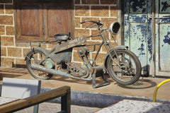 aboodi vesakaran - Rusty antique Harley Davidson motorcycle displayed outdoors in Dubai.