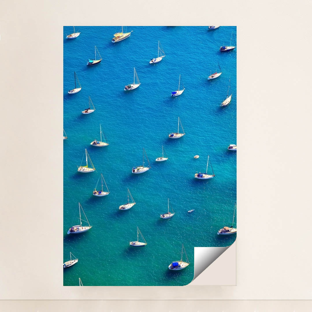 This artwork features an aerial view of moored sailboats on bright blue water, unframed.