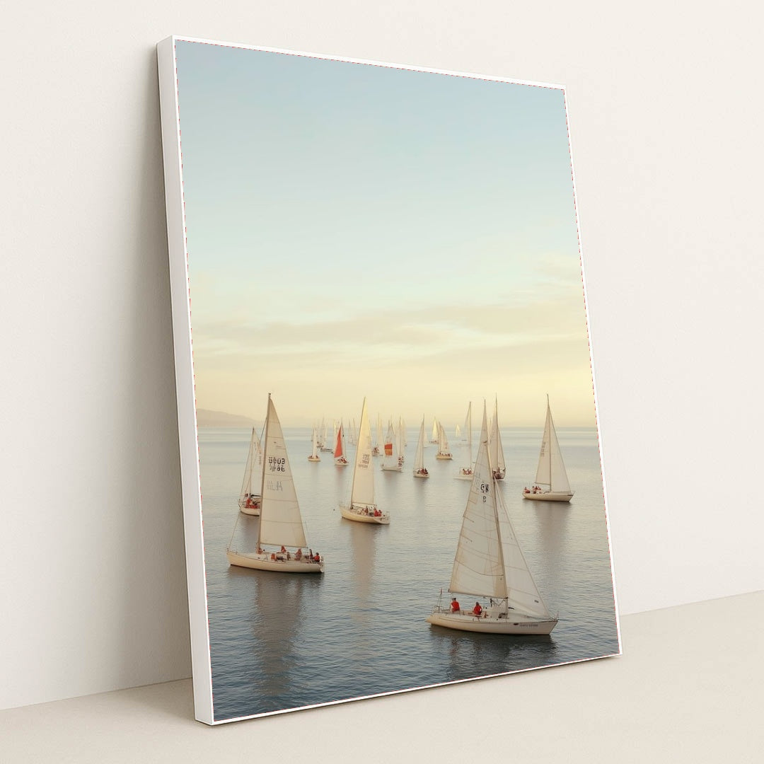 Golden Hour Regatta sailboat wall art, tranquil seascape canvas featuring elegant sailboats, displayed in a in white frame.