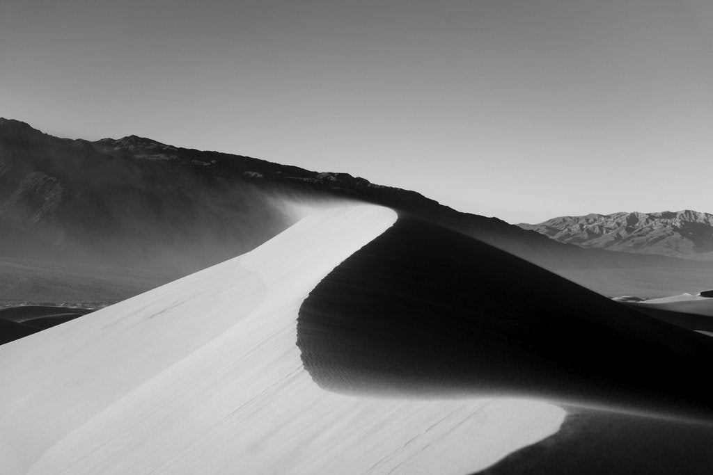 Jeremy Bishop - Black and white image capturing the striking sand dunes in California's desert landscape.