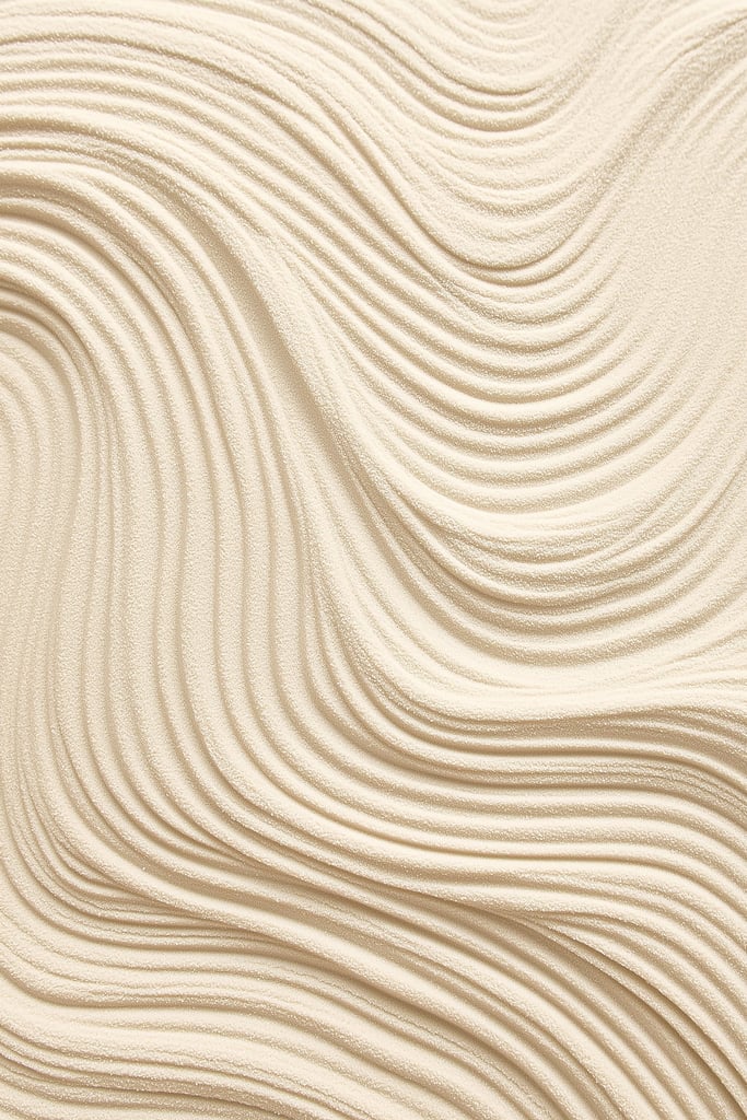 This artwork features smooth, wavy lines of textured tan sand in an abstract pattern.
