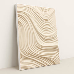 This artwork features smooth, wavy lines of textured tan sand in an abstract pattern, in a white frame.