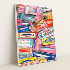 This artwork shows a colorful collection of decorative sardine cans with vintage-style labels, layered on a pink background, in a white frame.