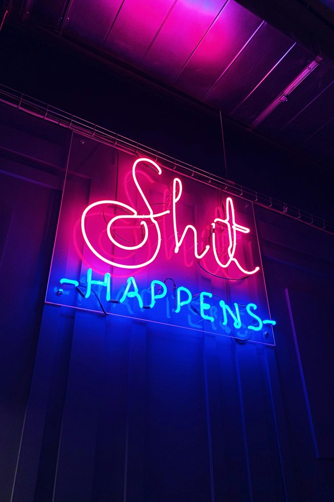Shit Happens neon sign by Artur Wayne