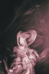 Safak Batura - Abstract pink smoke swirling on a dark background, creating mystical patterns and textures.