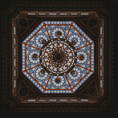 Willian Santos - A majestic stained glass dome ceiling viewed from below, showcasing detailed geometric patterns.