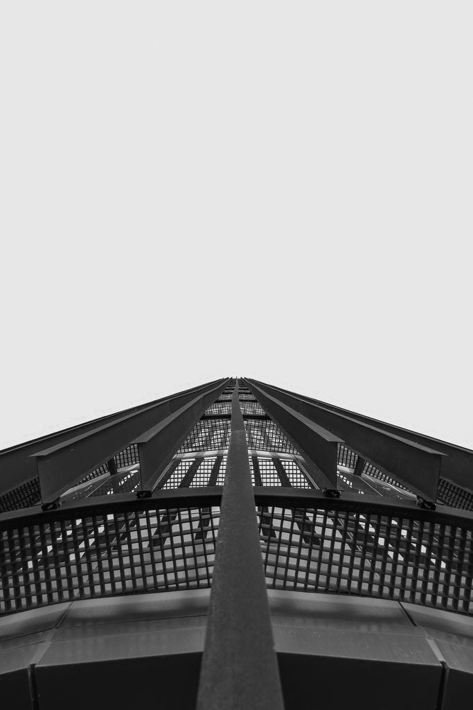 Josué Rodríguez - Abstract perspective of a steel architectural structure captured in black and white.