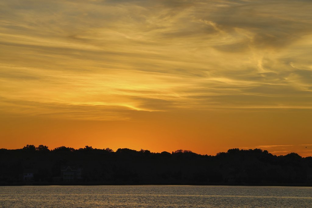 David Kanigan - Peaceful sunset over a lake in Stamford, Connecticut with vibrant sky.