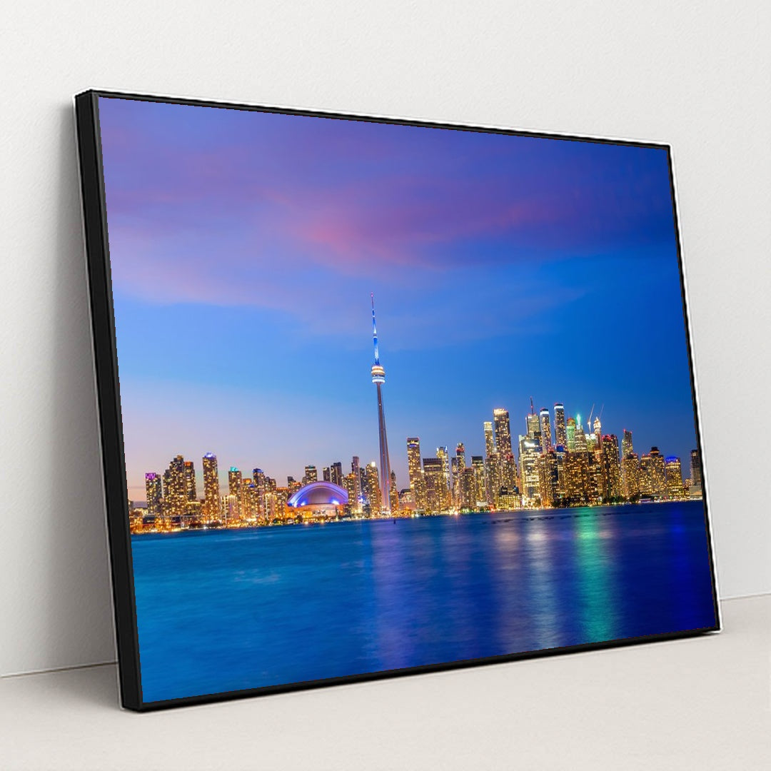 Vibrant Toronto Skyline at Sunset: A Colorful Evening View by Anonymous - Black Frame Stretchiez