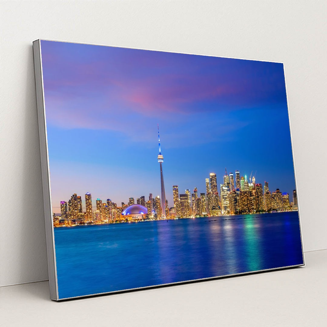 Vibrant Toronto Skyline at Sunset: A Colorful Evening View by Anonymous - Silver Frame Stretchiez