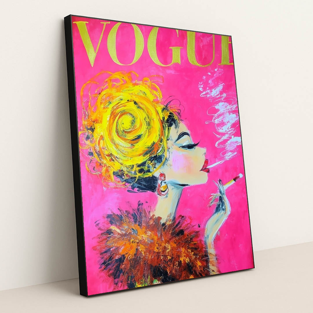 This artwork shows a glamorous painted woman with a yellow updo, feathered collar, and cigarette on a vivid pink Vogue magazine cover, in a black frame.