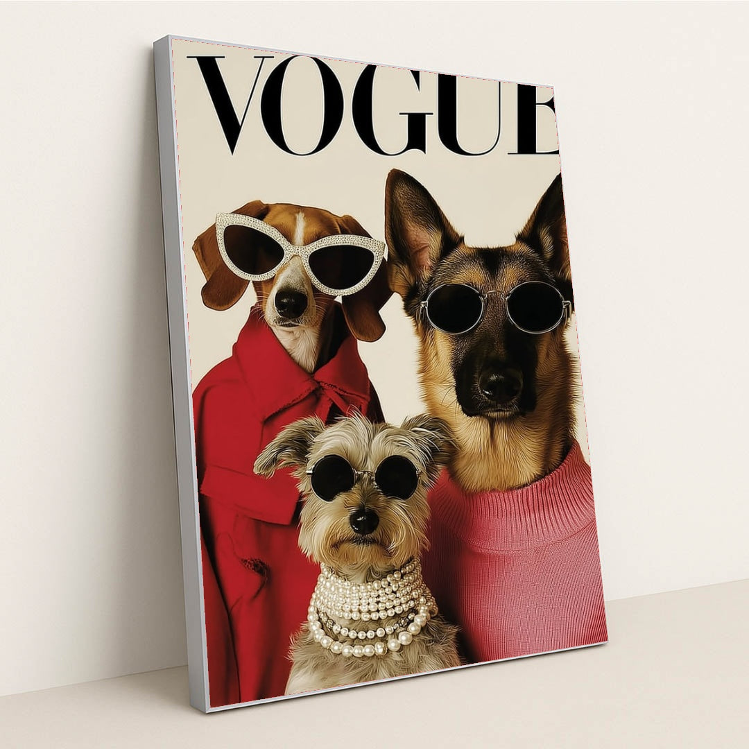 This artwork shows three stylish dogs wearing sunglasses, coats, and pearls posing on a Vogue magazine cover, in a silver frame.