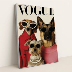 This artwork shows three stylish dogs wearing sunglasses, coats, and pearls posing on a Vogue magazine cover, in a silver frame.
