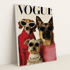 This artwork shows three stylish dogs wearing sunglasses, coats, and pearls posing on a Vogue magazine cover, in a white frame.