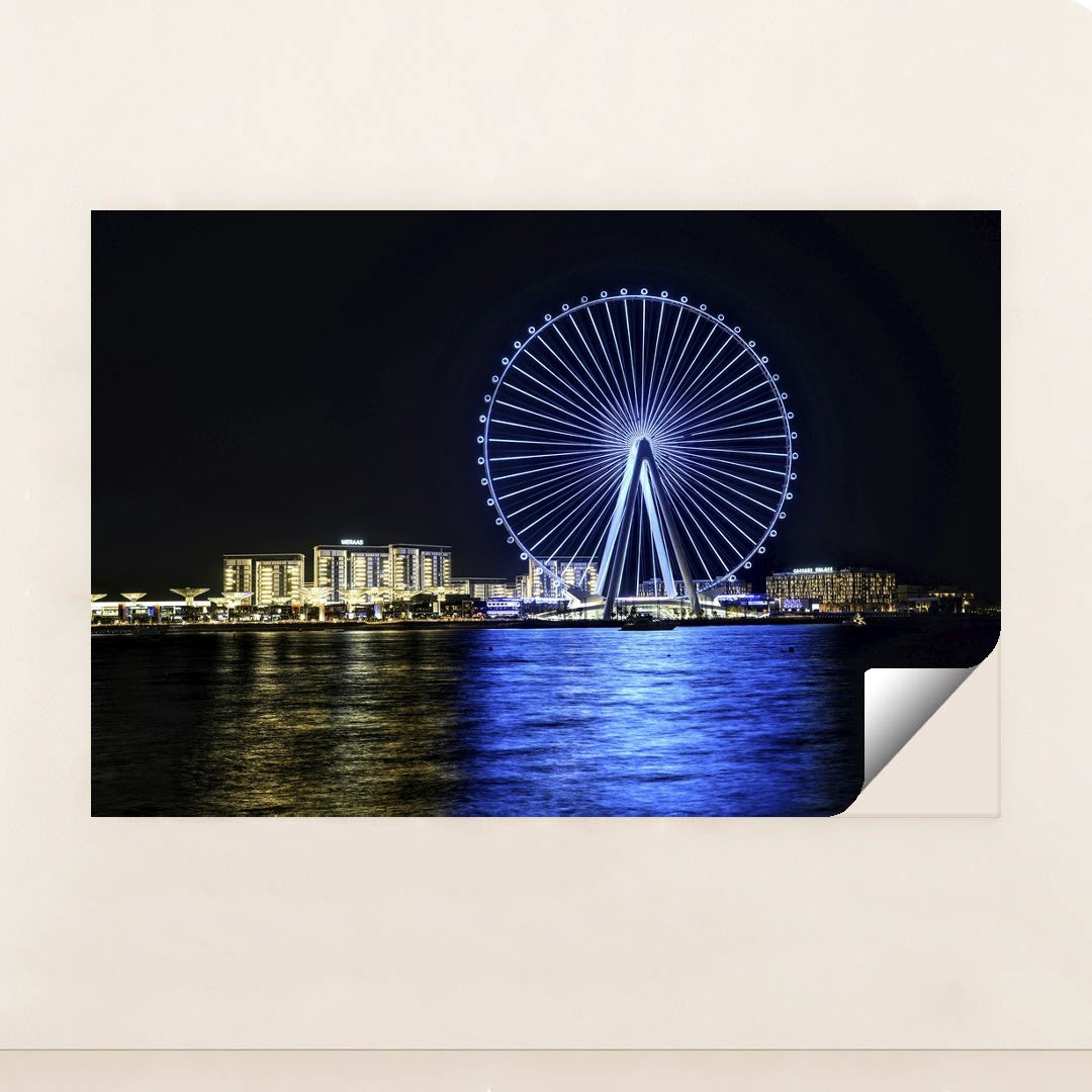 Dubai's Ferris Wheel at Night by Hugo Sykes - Peeliez